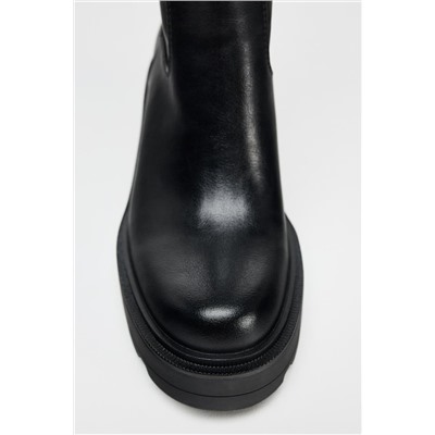 HEELED BOOTS WITH TRACK SOLES