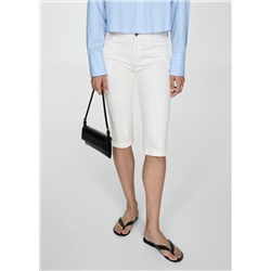 Jeans slim capri costuras decorativas
