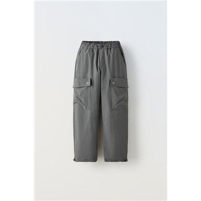 TECHNICAL TROUSERS WITH POCKETS