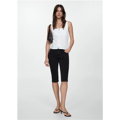 Jeans slim capri costuras decorativas