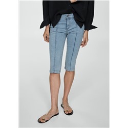 Jeans slim capri costuras decorativas