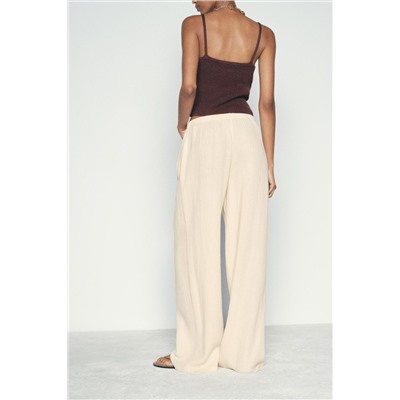 CREASED-EFFECT WIDE-LEG TROUSERS