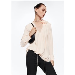 Blusa detalle flor