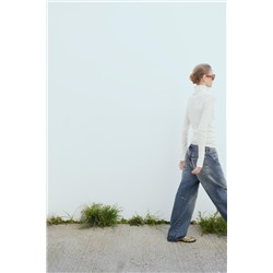 SEMI-SHEER DELICATE COTTON TOP WITH CUFFS AND SEAM DETAIL