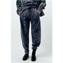 FADED-EFFECT CARROT FIT PLUSH TROUSERS