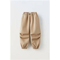 PANTALÓN PARACHUTE EFECTO PIEL