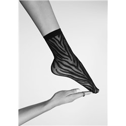 Gemusterte transparente Socken