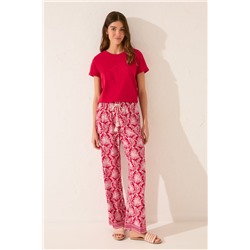 Pantalón largo viscosa estampado hojas rojo