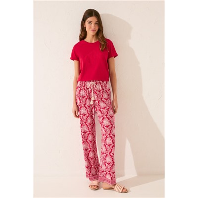 Pantalón largo viscosa estampado hojas rojo