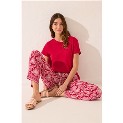 Pantalón largo viscosa estampado hojas rojo