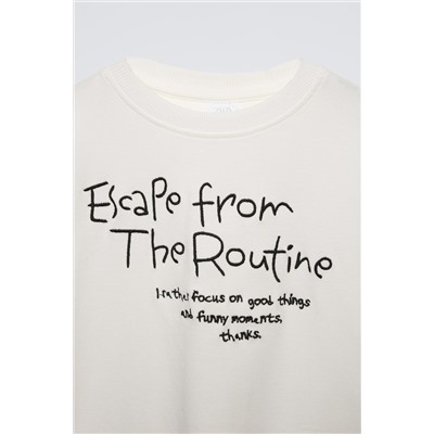 T-SHIRT WITH EMBROIDERED SLOGAN
