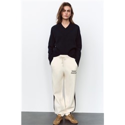 JOGGING TROUSERS WITH SLOGAN