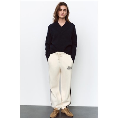 JOGGING TROUSERS WITH SLOGAN