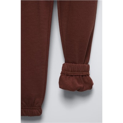 TROUSERS WITH EMBROIDERED SLOGAN