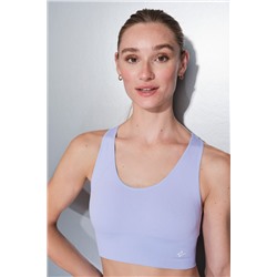 Sujetador deportivo reversible lila y blanco
