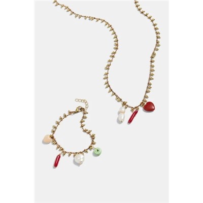 Collar largo dorado charms