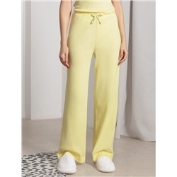 Прямые брюки с поясом на резинке из фактурного трикотажа в рубчик