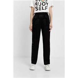 Pantalón en logomanía brillante
