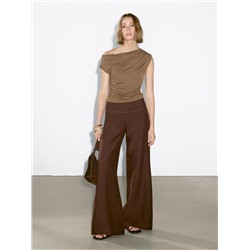 Top asimétrico detalle drapeado