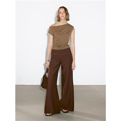 Top asimétrico detalle drapeado