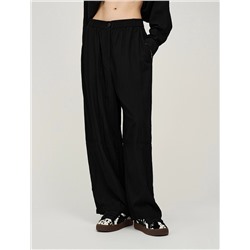 Черные брюки с вырезом ниже колена