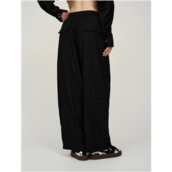 Черные брюки с вырезом ниже колена