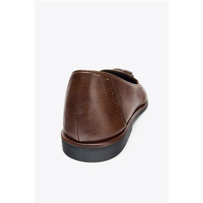 MOCASÍN BORLAS PIEL