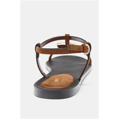 FLAT SANDALS WITH METAL EMBELLISHMENT