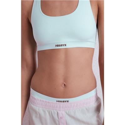 Top deportivo seamless canalé verde