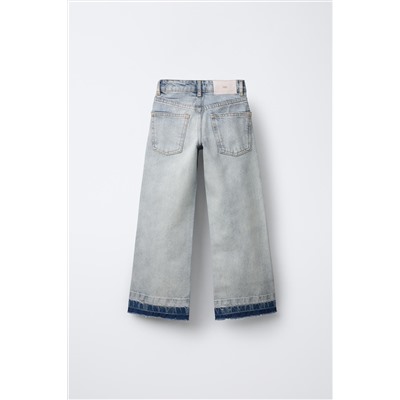 FLARED JEANS WITH RAW HEMS