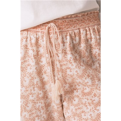 Pantalón skinny 100% algodón flores naranja