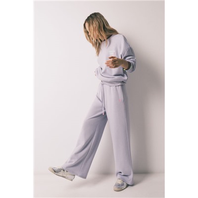 Pantalón largo flare felpa lila