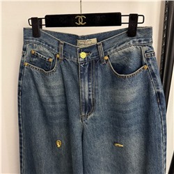 Женские стильные джинсы украшенные золотыми пуговицами особой формы  Schiaparell*i