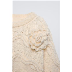 CABLE-KNIT CAPE WITH FLOWER