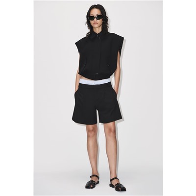 CHALECO CUELLO CAMISERO BOLSILLOS