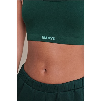 Top deportivo seamless canalé verde oscuro