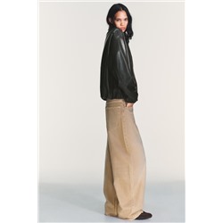 LEATHER EFFECT JACKET WITH ELASTICATED DETAILS