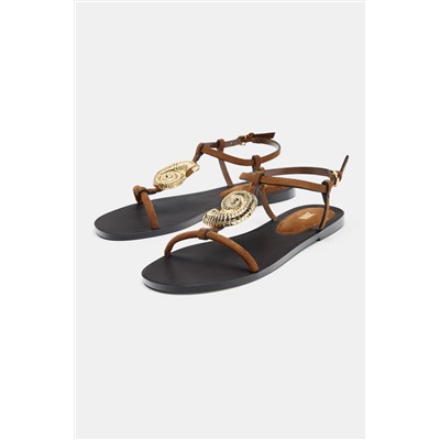 FLAT SANDALS WITH METAL EMBELLISHMENT