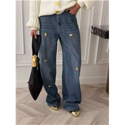 Женские стильные джинсы украшенные золотыми пуговицами особой формы  Schiaparell*i