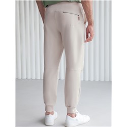 Брюки из тонкого футера с карманом на молнии