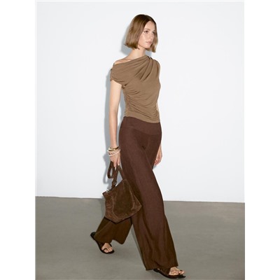 Top asimétrico detalle drapeado