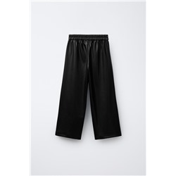 FAUX LEATHER TROUSERS WITH BOWS