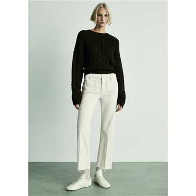 Jeans flare crop bolsillos