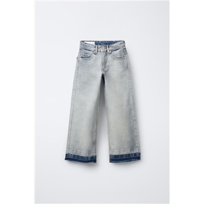 FLARED JEANS WITH RAW HEMS