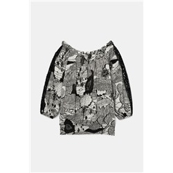 Blusa blanca y negra encaje mangas