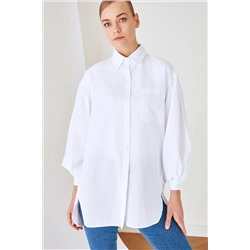 TRENDYOL MODEST Beyaz Balon Kol Arkası Uzun Cep Detaylı Basic Dokuma Gömlek TCTSS21GO0976