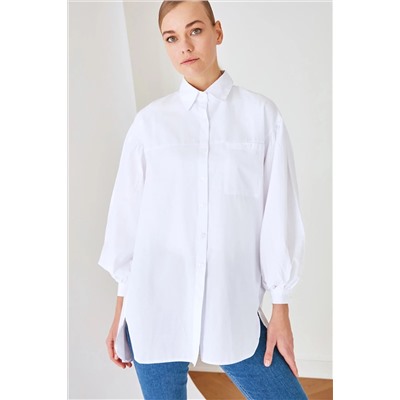 TRENDYOL MODEST Beyaz Balon Kol Arkası Uzun Cep Detaylı Basic Dokuma Gömlek TCTSS21GO0976