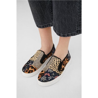 Sneakers slip on de piel