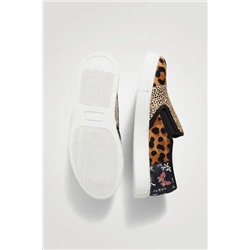 Sneakers slip on de piel
