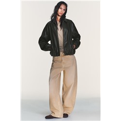 LEATHER EFFECT JACKET WITH ELASTICATED DETAILS